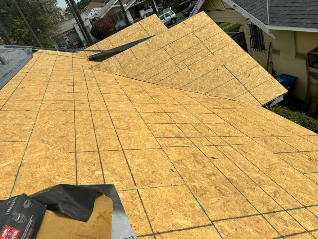 Wood roof deck panels meeting at intersecting slopes