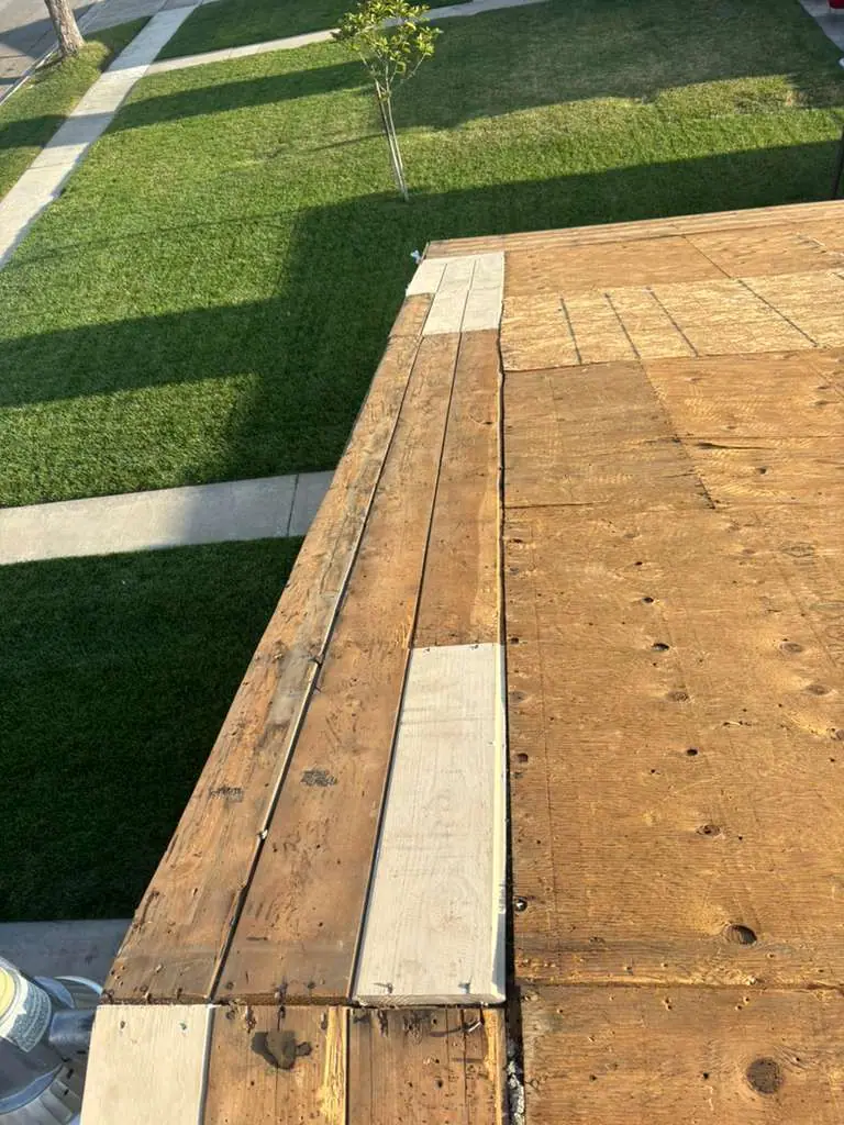 Exposed wood roof decking with boards along the roof edge